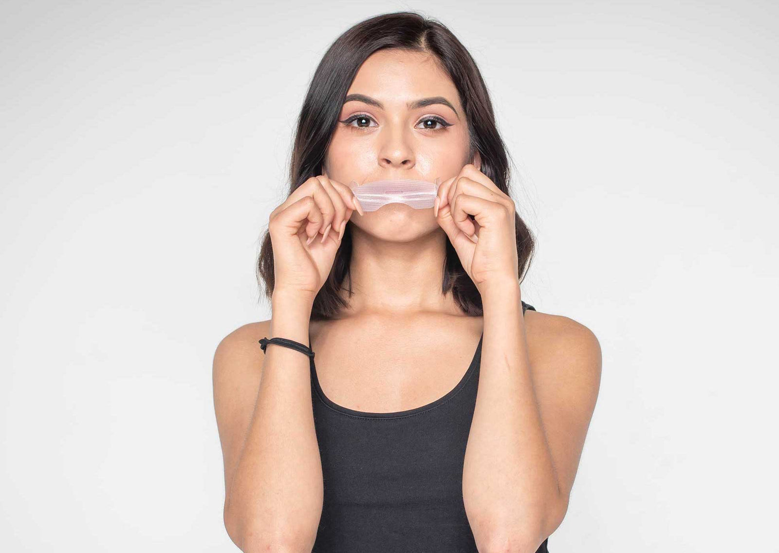 girl holding mouth tape somnifix