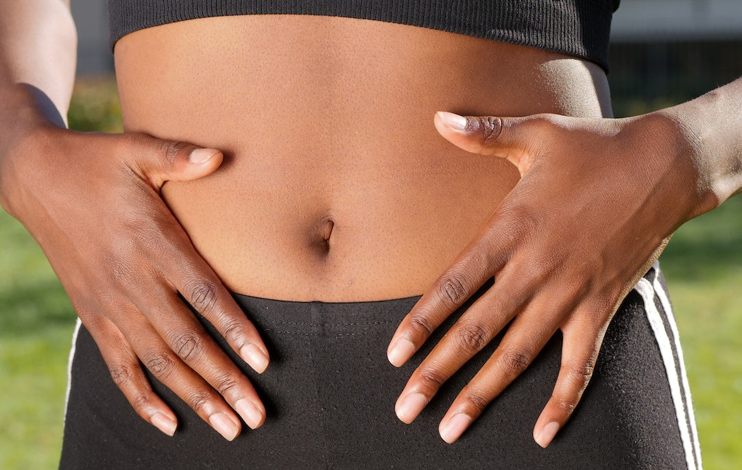 Woman holding stomach