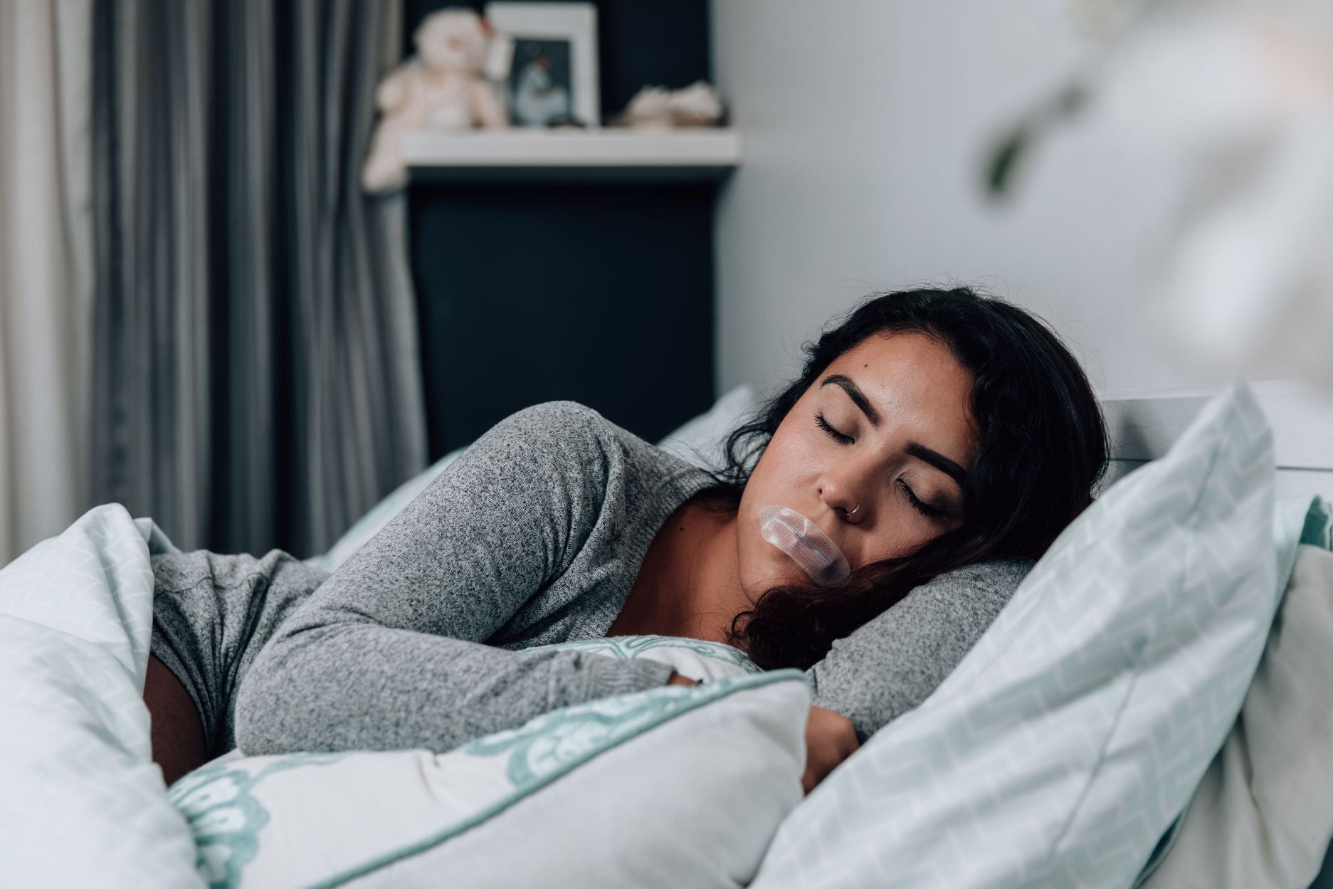 woman sleeping with mouth tape on