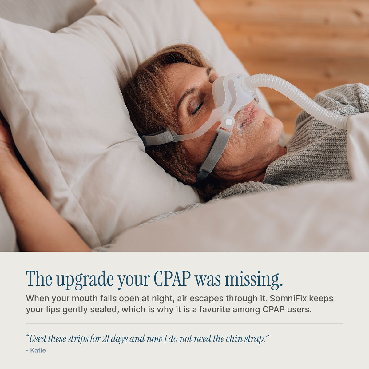 Woman asleep in a CPAP nasal mask wearing SomniFix mouth tape, which keeps lips sealed so therapy air is not lost through the mouth.
